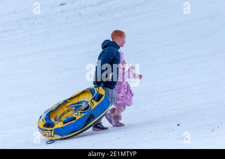 Glasgow, Scotland, UK. 8th January, 2021. UK Weather: Sledging in Queen's Park. Credit: Skully/Alamy Live News Stock Photo