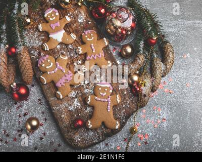 Christmas homemade gingerbread cookies on a wooden table, Christmas toys, cones Stock Photo
