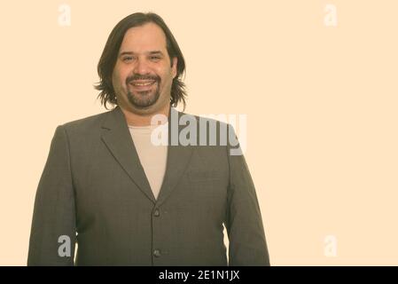 Happy fat Caucasian businessman smiling Stock Photo