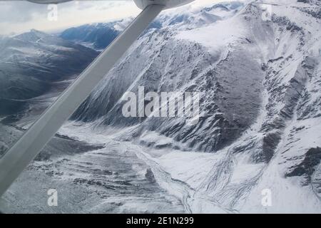 Flying over Brooks Mountain Range in the Arctic Circle on the way to Kaktovik Stock Photo