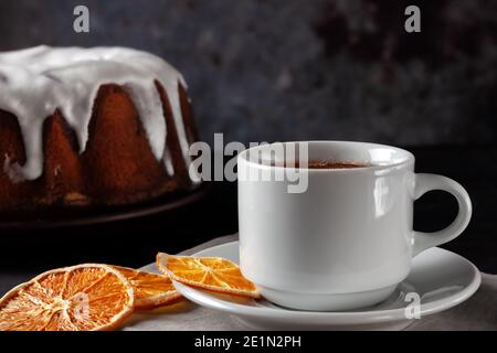 Cup of tea with oranges and a piece of homemade muffin Stock Photo
