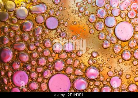 Colorful abstract macro background with oil drops in water Stock Photo