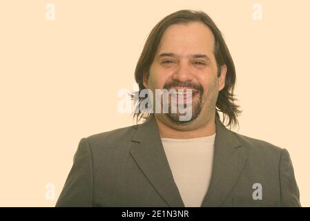 Happy fat Caucasian businessman smiling Stock Photo