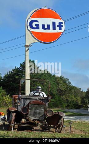 An antique car and Gulf sign stand at Bob's Gasoline Alley, a collection of antique gas station memorabilia near Cuba, Missouri that closed in 2020. Stock Photo