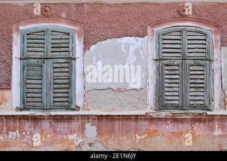 windows with shutters on abandoned traditional house, rchitectural background Stock Photo
