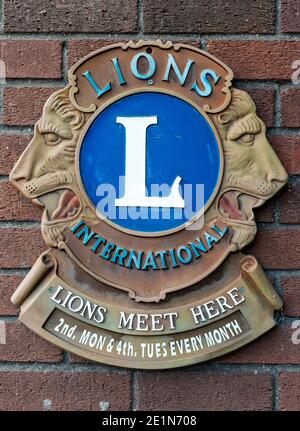 Lions Clubs International or 'Liberty, Intelligence, Our Nations' Safety' organization logo signage or sign on brick wall outside Maldron Hotel at Dublin Airport Ireland Europe EU Stock Photo