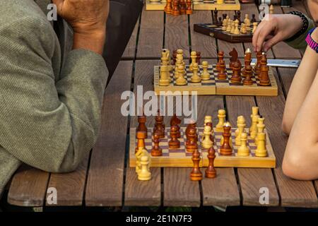 Close up of people playing chess, outdoor, some boards Stock Photo