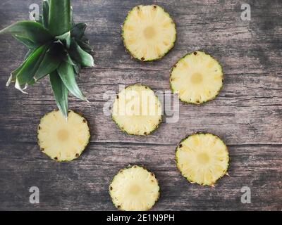 Sliced and chopped pineapple on a dark background Stock Photo