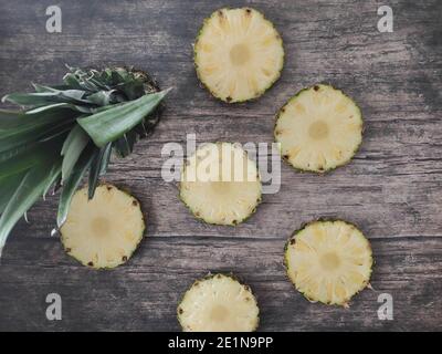 Sliced and chopped pineapple on a dark background Stock Photo