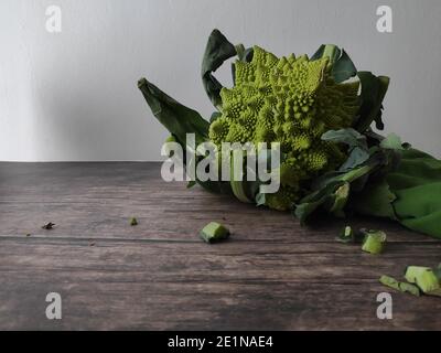 A whole romanesco broccoli on a kitchen table Stock Photo