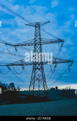 high voltage post,High voltage tower sky surise background Stock Photo