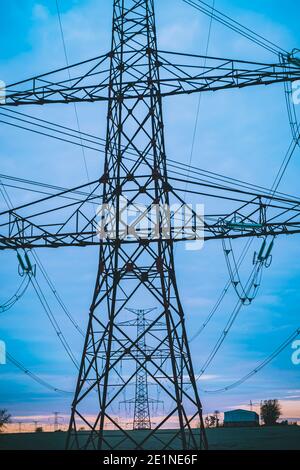 high voltage post,High voltage tower sky surise background Stock Photo