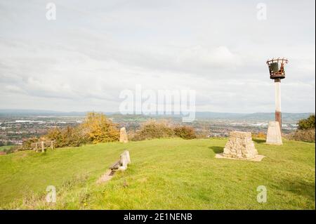 The millennium beacon, trig point and view across the city of Gloucester and beyond from the top of Robinswood Hill Country Park, Gloucester, England, Stock Photo