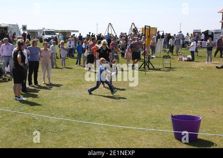 South Ayrshire Council Armed Forces Day , Holy Fair , Pipes in the Park, 2016. Boy kicking rugby ball Stock Photo