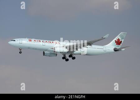 Air Canada Airbus A330-300 with registration C-GHKW on short final for runway 25L of Frankfurt Airport. Stock Photo