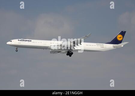 German Lufthansa Airbus A340-600 with registration D-AIHI on short final for runway 25L of Frankfurt Airport. Stock Photo