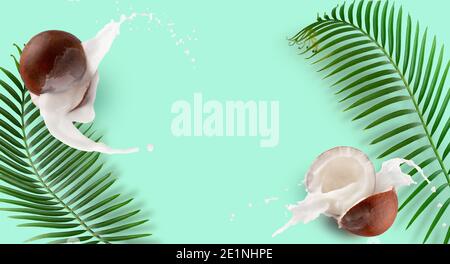pattern with coconuts, milk splash and palm leaves on a green mint background. Stock Photo