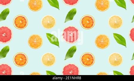 seamless pattern with citrus and leaves on a light blue background. Stock Photo