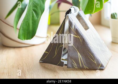 Miniature of a tent made of cotton. Hobby, sewing eco friendly toys. Camping. Stock Photo