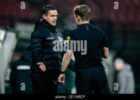 NIJMEGEN, NETHERLANDS - JANUARY 8: (L-R): Head Coach Rogier Meijer of NEC protesting, receiving yellow card by Referee Ingmar Oostrom during the Dutch Stock Photo