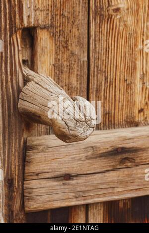 An old wooden doorknob, rusty nails around it in Turkey Stock Photo