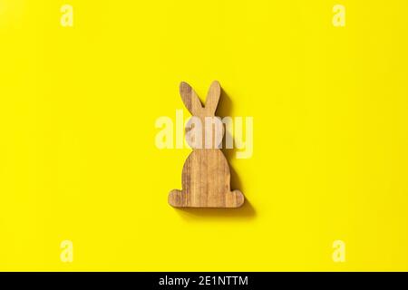 Creative minimal Happy Easter design the rabbit on Illuminating Yellow Color of the year 2021. Top view flat lay background. Copy space. Stock Photo