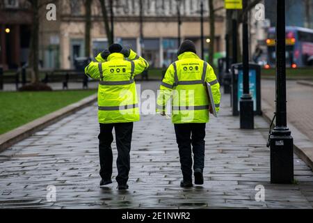COVID Marshals on patrol on College Green In Bristol in the United Kingdom. Stock Photo