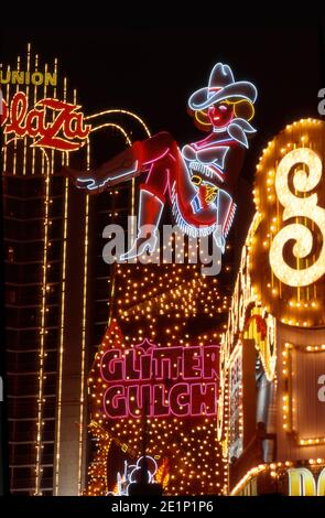 Iconic neon cowgirl at Glitter Gulch on Fremont Street in Las Vegas, Nevada Stock Photo