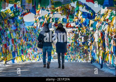 Lovers are walking accross buddist wishes at the Datsan 'Rinpoche Bagsha' monstery in Ulan Ude, Siberia, Russia Stock Photo
