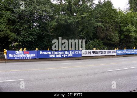 A line of Falun Gong protesters holding banners across from the Consulate General of China on South Granville Street, Vancouver, British Columbia, Can Stock Photo