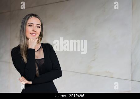 Shallow focus shot of a beautiful woman wearing a classy black dress Stock Photo