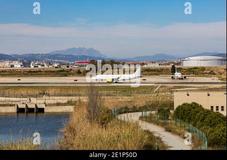 Landing strip at Barcelona airport with planes on the runway Stock Photo