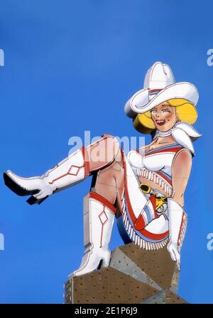 Iconic Cowgirl neon sign on Fremont Street in Downtown Las Vegas, Nevada Stock Photo