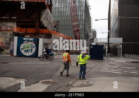 (210109) -- NEW YORK, Jan. 9, 2021 (Xinhua) -- Construction workers walk in front of the Ronald O. Perelman Performing Arts Center at the World Trade Center construction site, in New York, United States, Jan. 8, 2021. U.S. employers slashed 140,000 jobs in December, the first monthly decline since April 2020, as the recent COVID-19 spikes disrupted labor market recovery, the Labor Department reported Friday. The unemployment rate, which has been trending down over the past seven months, remained unchanged at 6.7 percent, according to the monthly employment report. (Photo by Michael Nagle/Xinhu Stock Photo