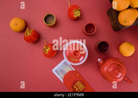 Lunar new year decoration traditional with Chinese Asian Vietnamese New Year Money Vietnamese dong on red envelope Tet is lucky money (Foreign text means spring season) Stock Photo