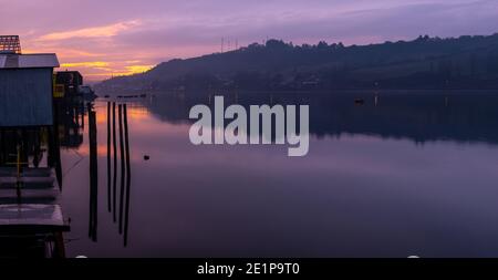 Sunset in Castro city along its stilt houses or palafitos, Chiloe Island, Chile. Stock Photo