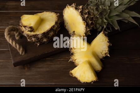 pineapple on a wooden background. selective focus. Sliced fresh fruit Stock Photo