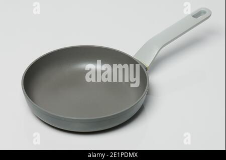 Ceramic gray cooking pan with handle isolated Stock Photo