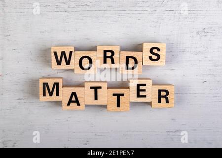 wooden blocks  in a white and grey board with the text words matter Stock Photo