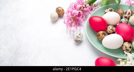 Spring composition. Green mint plate with easter eggs, on stone background. Horizontal banner. Copy space for text - Image Stock Photo