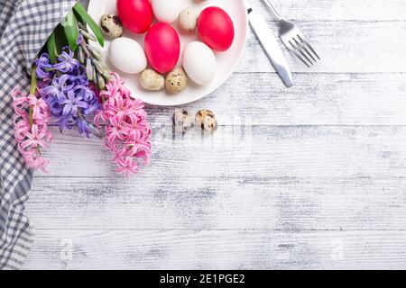 Easter eggs, pink and white hyacinth on wooden background. Easter concept. Top view. Copy space - Image Stock Photo