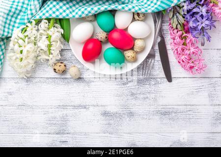 Easter eggs, pink and white hyacinth on wooden background. Easter concept. Top view. Copy space - Image Stock Photo