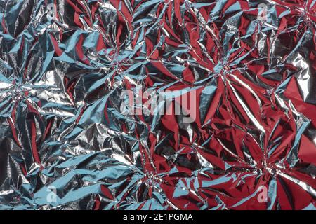 Abstract background with crumpled foil texture, silver, re Stock Photo