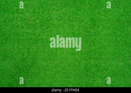 Thai native fan made from bamboo weave colorful isolated on green artificial grass. Stock Photo