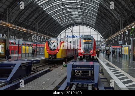 Trains and unidentified passengers in the central station of Frankfurt am Main, Germany Stock Photo