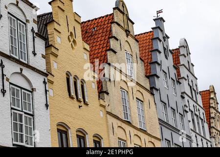 A row of historic gabled houses on the market square in Friedrichstadt, Schleswig-Holstein, Germany Stock Photo