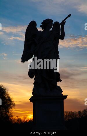 Rome - The silhouette of angel with the Lance from the Angels bridge. Stock Photo