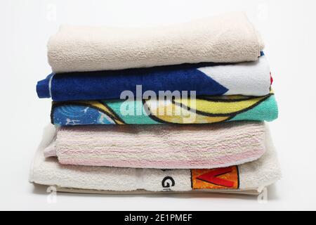 Stack of Towels on White Background Stock Photo