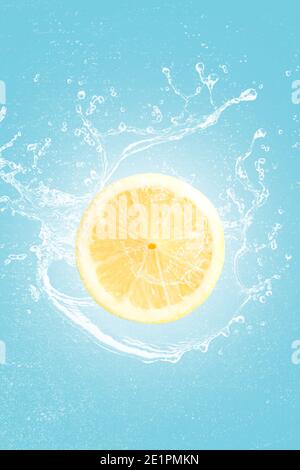 Lemon slice with water splash isolated on blue blackground. Stock Photo