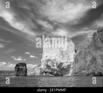 Santorini - The white rock towers from south part of the island. Stock Photo